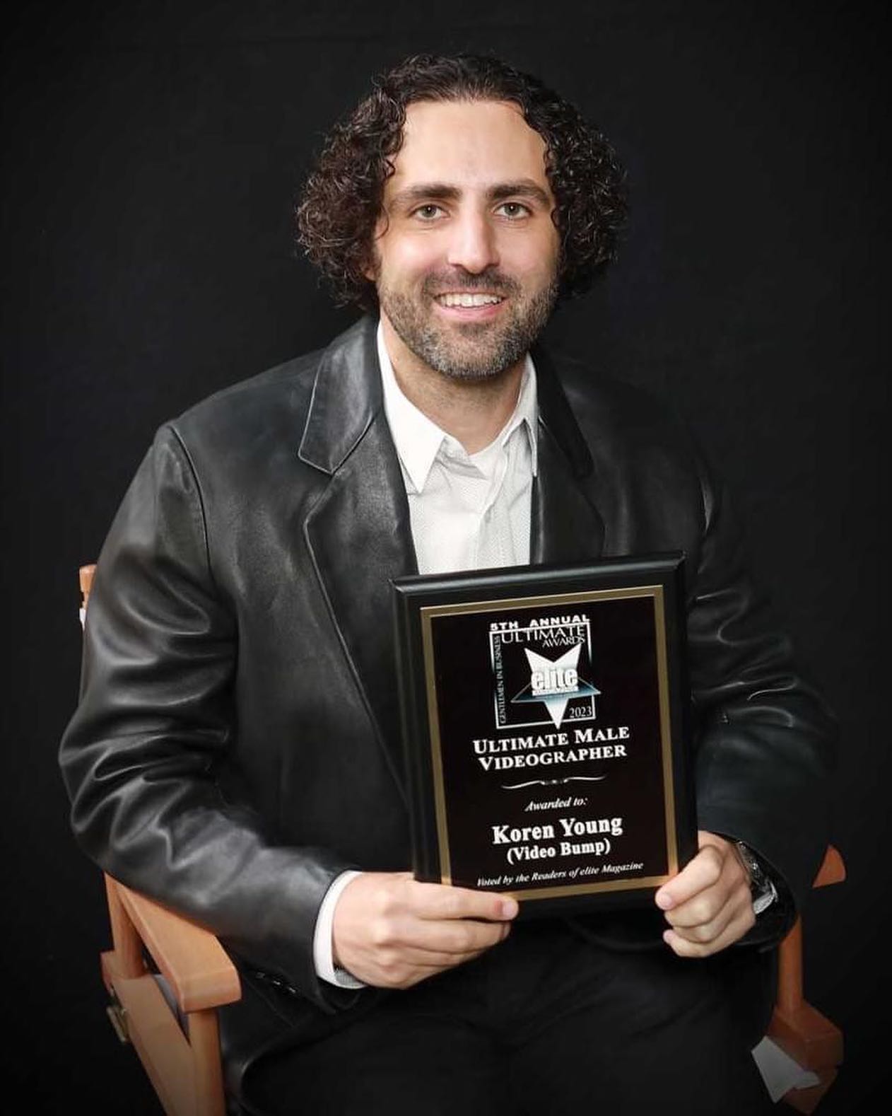 Koren Young holding his 2023 Ultimate Male Videographer award from SCV Elite Magazine